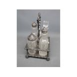 Silver plated cruet stand with four cut glass bottles
