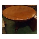 19th century mahogany pedestal dining table, raised on tripod base with paw feet, 46" wide