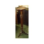 Late 19th or early 20th century mahogany torchere stand on tripod base with ball and claw feet