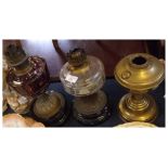 Mixed Lot: three assorted antique oil lamp bases, two with glass fonts, the other brass, largest 14"