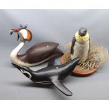 Mixed Lot: carved wooden great crested grebe, together with two further model penguins (3)