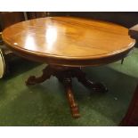 Victorian mahogany dining table of oval form raised on a heavy turned base and four splayed feet,