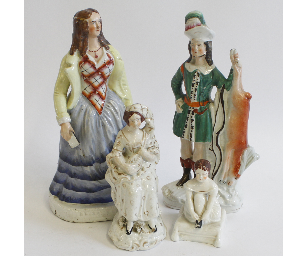 Collection of four 19th century Staffordshire figures: Archer with stag, Eliza Cook, seated young