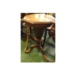 Victorian walnut framed sewing table, with hexagonal top and fitted compartmentalised interior, on a