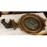 19th century giltwood wall mirror, of circular form, with applied foliate and ball detail with eagle