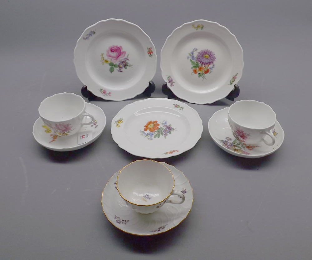 Collection of 20th century Meissen wares: two cups and saucers and three tea plates, all painted