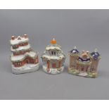 Group of three 19th century Staffordshire model cottages, varying designs, largest 6 1/2" high