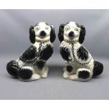 Pair of Staffordshire black and white model spaniels