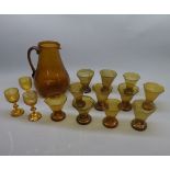 Mixed Lot: amber glass wares comprising jugs, eleven glasses and three further small non-matching