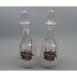 Pair of 19th century cut clear glass decanters, and accompanying plated labels marked Port and