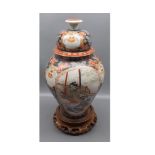 Late 19th or early 20th century Japanese covered vase, decorated with panels of various figures,