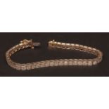 Modern precious metal and diamond tennis bracelet, the box links set with forty-four small