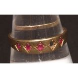 Late 19th century 15ct gold and ruby ring, the plain band set with four small oval cut rubies (one
