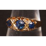 18ct gold sapphire and diamond ring, the three circular cut sapphires interspersed with four small