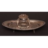 Edward VII inkstand, the oval body with cast and applied rope twist border with central facetted