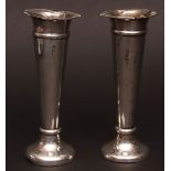 Two Edward VII trumpet vases, each with flared and shaped rims, tapering bodies, and raised on