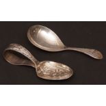 Mixed Lot: Old English pattern caddy spoon, together with a child's feeding spoon decorated with the