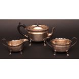 Composite late Victorian three piece tea set, comprising teapot, sugar basin and milk jug, each of