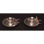 Pair of late 19th century electro-plated chamber sticks each of circular saucer form with applied