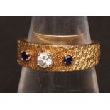 20th century gold, sapphire and diamond three stone ring, the old brilliant cut diamond with