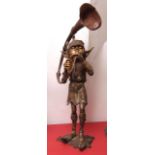 Bronze patinated metal garden sculpture depicting a mythological elf blowing a horn, modern, 38 3/4"