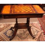 Regency style games table, the central playing board with sliding cover, frieze fitted all around