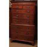 Early 19th century mahogany chest on chest, moulded dentil cornice and the upper section with two