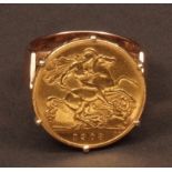 Edward VII half-sovereign ring dated 1908, claw set in a yellow metal pierced basket gallery