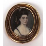 ENGLISH SCHOOL (19TH CENTURY) Head and shoulders portrait of a lady portrait miniature set in brooch