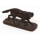 P J Mene, signed patinated bronze study of a retriever, on a moss encrusted base, 5 1/2" long