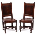 18th century and later pair of plain oak hall chairs, two uprights with pointed finials, solid