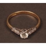 20th century 18ct gold solitaire diamond ring, the brilliant cut diamond (0.34ct) with 3 small