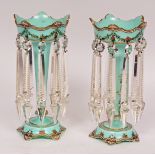Good pair of 19th century pale green glass lustres, the hipped rims gilded and over-painted in black