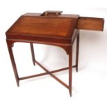 Georgian mahogany housekeepers desk, the top with a central lidded compartment with pen tray, over a