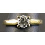 Modern yellow metal and diamond single stone ring set with a round brilliant cut diamond (0.25ct