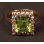 Early 20th century diamond and peridot ring, the square cut peridot (5mm) surrounded by 18 single