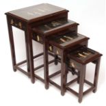 Quarteto of mahogany tables, each inset with chinoiserie panels depicting figures, pagodas etc,