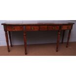 Early 19th century mahogany serving table, of breakfront serpentine form, the large central frieze