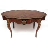 19th century ebonised gilt metal mounted red boulle centre table of shaped oval form, fitted on