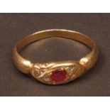 Victorian gold, ruby and diamond ring, the circular cut ruby set between two small rose cut