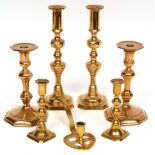 Three pairs of brass candlesticks, unusual "luck and ..." novelty chamber candlestick