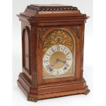 Early 20th century walnut cased mantel clock, Lenzkirch, the case with overhanging cornice and