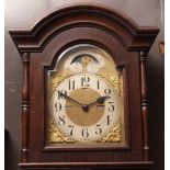 Second half of 20th century stained oak cased triple weight driven longcase clock, the hood with