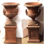 Pair of decorative modern composition two-handled garden urns in terracotta effect, 40" high