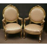 Pair of Louis Quinze style giltwood open salon chairs, reupholstered in modern traditional