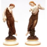 Near pair of Royal Worcester figures of maidens clutching vessels, one wearing a gilded sprig-