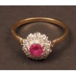 Mid-20th century 18ct gold ruby and diamond cluster ring, the centre set with a circular faceted