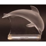 Lalique model of a leaping dolphin, with frosted body on a clear stand, modern, in a plush-lined