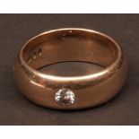 Gent's 9ct gold dress ring, the wide band set with a central small brilliant cut diamond (0.20ct