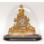 Late 19th Century French gilt spelter and porcelain mounted mantel clock, the shaped case surmounted